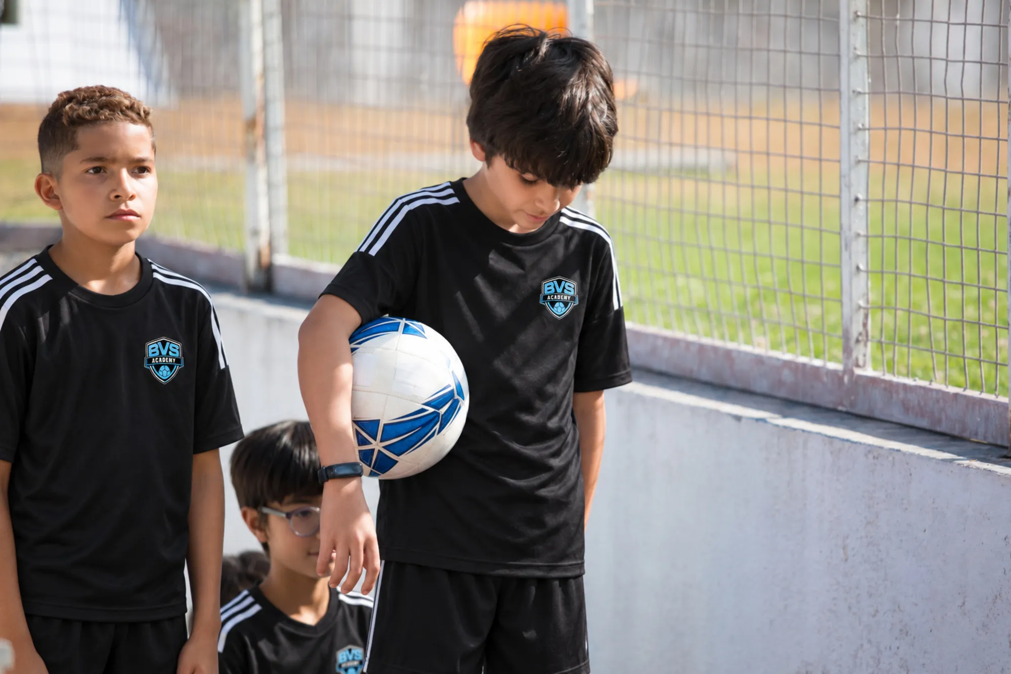 Young BVS player holding the ball under his arm